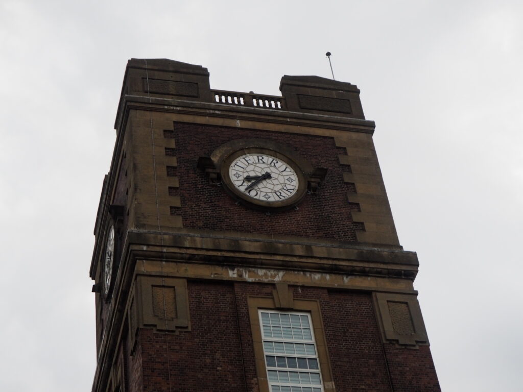 A close up of the clock face on the Terry's Clock Tower. The letters on the clock say Terry York.