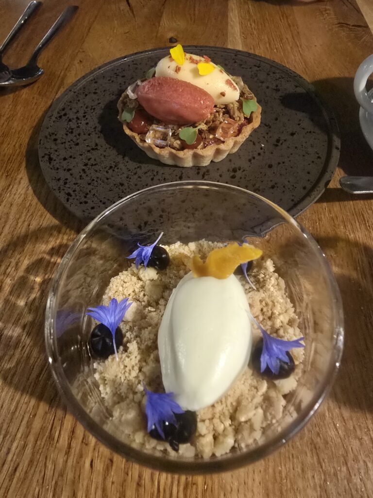 Two desserts on the table. Nearest the camera is the "Terry's" Old Fashioned Chocolate Mousse. Behind it is the Strawberry & Elderflower Tartlet.